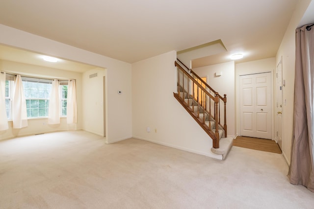 3048 Turnberry Ln, Ann Arbor, MI 48108 - carpeted empty room with stairway and baseboards