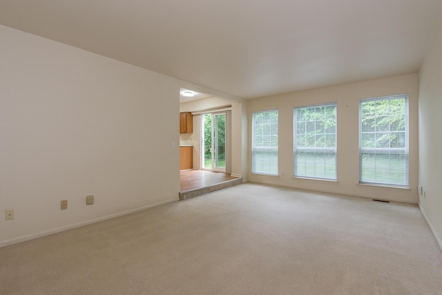 3048 Turnberry Ln, Ann Arbor, MI 48108 - unfurnished room featuring light carpet and baseboards