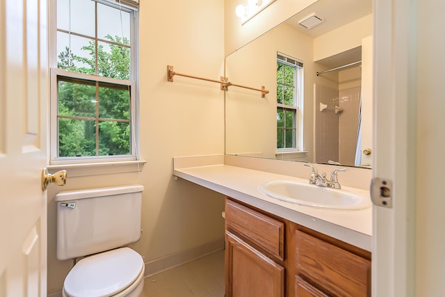 3048 Turnberry Ln, Ann Arbor, MI 48108 - bathroom with toilet, vanity, a shower, tile patterned floors, and baseboards