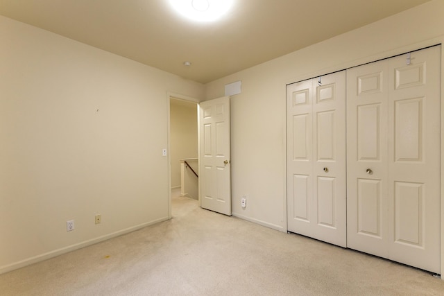 3048 Turnberry Ln, Ann Arbor, MI 48108 - unfurnished bedroom with light carpet, baseboards, and a closet