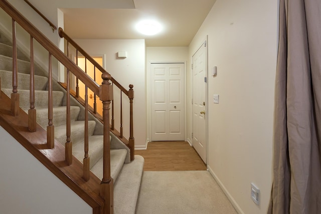 3048 Turnberry Ln, Ann Arbor, MI 48108 - entrance foyer featuring baseboards, stairway, and light carpet