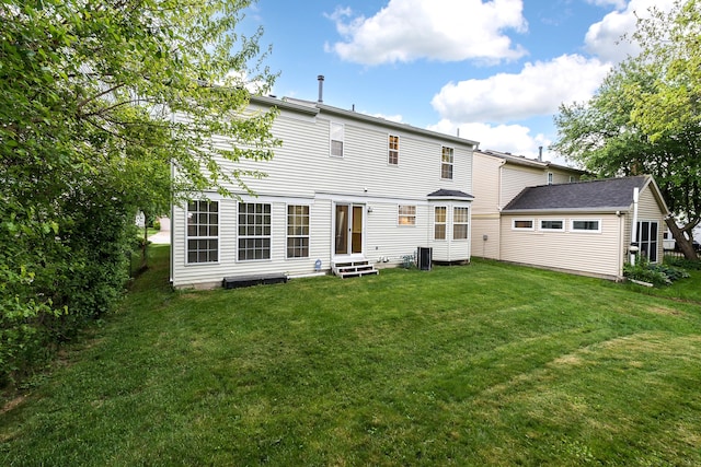 3048 Turnberry Ln, Ann Arbor, MI 48108 - back of house with entry steps and a yard