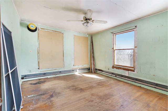 11333 Stony Creek Rd, Milan, MI 48160 - unfurnished room with ornamental molding, ceiling fan, a baseboard heating unit, and hardwood / wood-style flooring