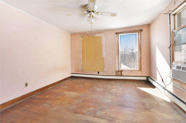 11333 Stony Creek Rd, Milan, MI 48160 - spare room with baseboards, a baseboard heating unit, hardwood / wood-style floors, and ceiling fan