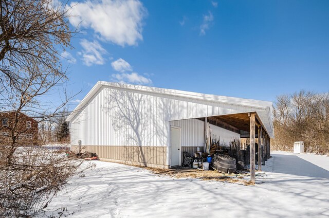 11333 Stony Creek Rd, Milan, MI 48160 - snow covered property featuring an outbuilding and a pole building
