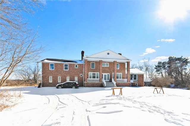 11333 Stony Creek Rd, Milan, MI 48160 - snow covered back of property featuring brick siding