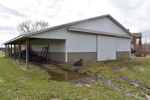 11333 Stony Creek Rd, Milan, MI 48160 - view of side of property featuring a yard, an outdoor structure, and an outbuilding