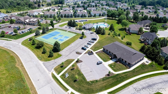 birds eye view of property with a residential view