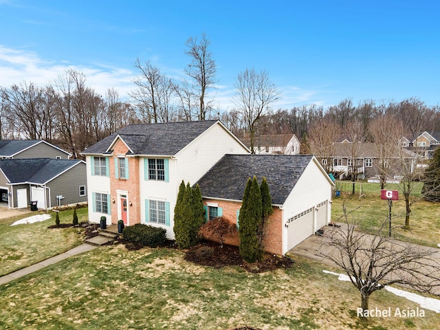 view of front of property with a garage, brick siding, a residential view, and a front yard