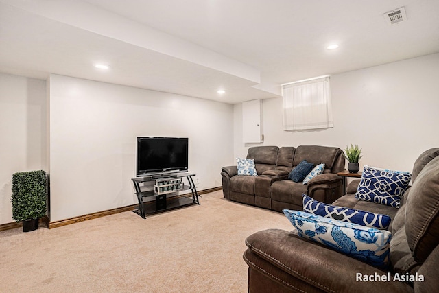 living room with recessed lighting, light carpet, visible vents, and baseboards