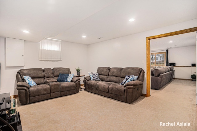 living area featuring recessed lighting, light colored carpet, and baseboards