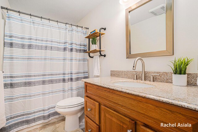 full bath with toilet, visible vents, and vanity