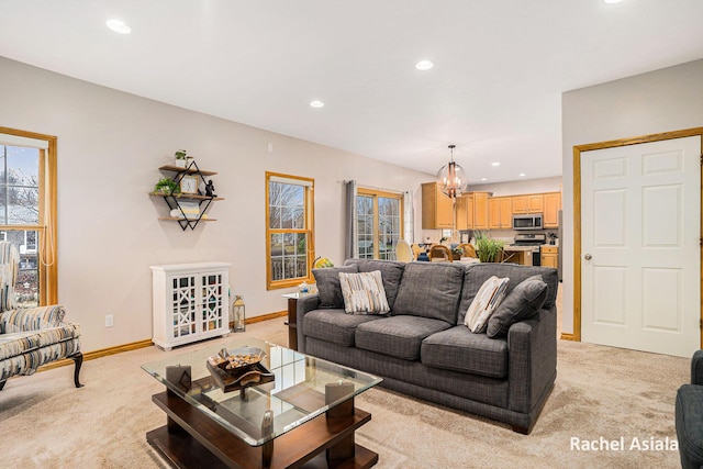 living area featuring light carpet, baseboards, and recessed lighting