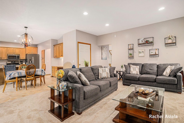 living area featuring light tile patterned floors, recessed lighting, light carpet, and an inviting chandelier