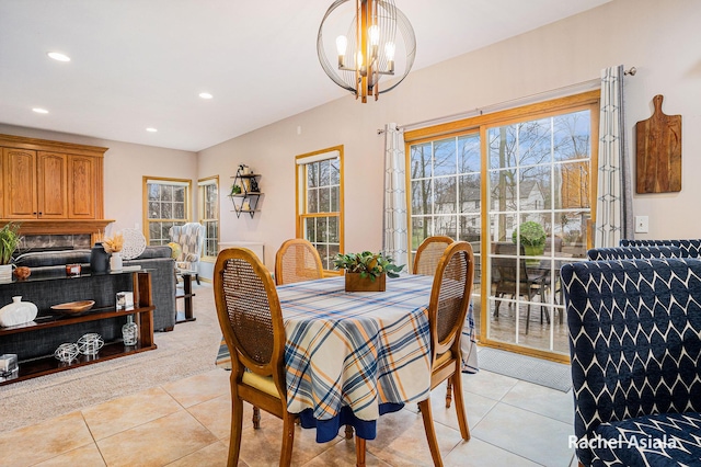 dining room featuring light tile patterned floors, a chandelier, and recessed lighting