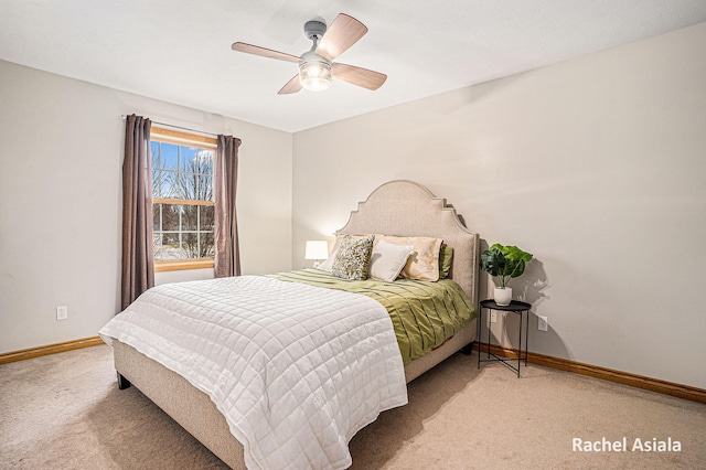 carpeted bedroom featuring a ceiling fan and baseboards