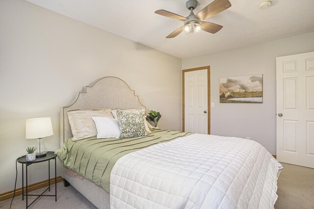 bedroom featuring a ceiling fan, carpet flooring, and baseboards