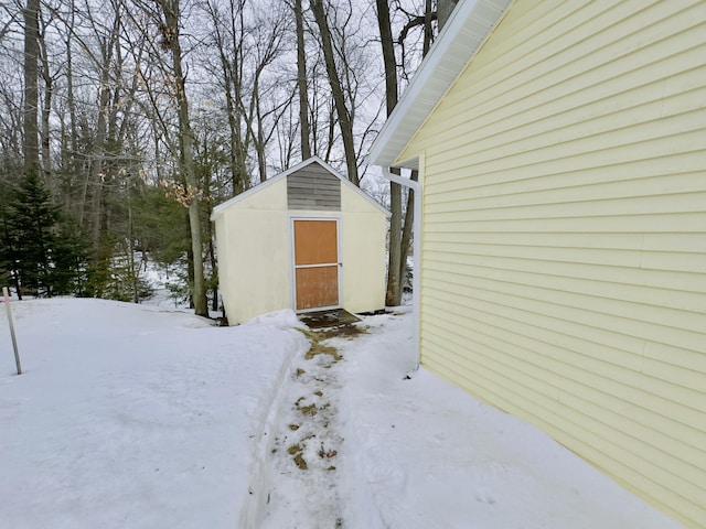 exterior space featuring a storage shed and an outbuilding