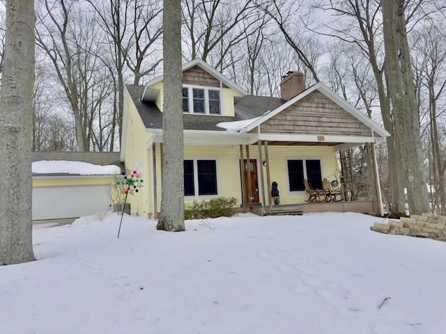 view of front of house with a porch and a chimney