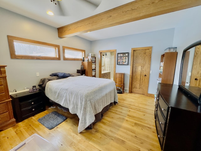 bedroom featuring light wood-type flooring, beamed ceiling, and baseboards