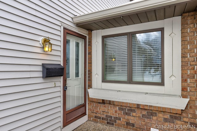 property entrance with brick siding