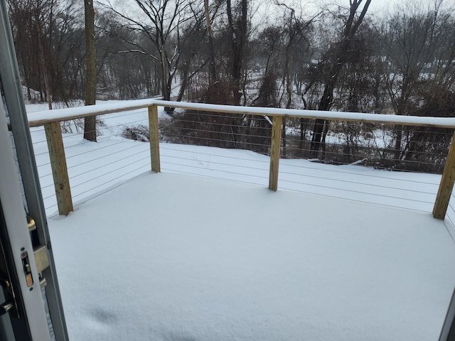 view of snow covered deck