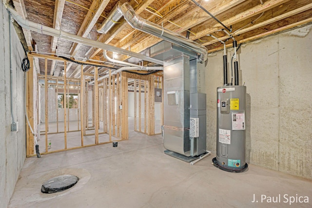 basement featuring electric panel, electric water heater, and heating unit