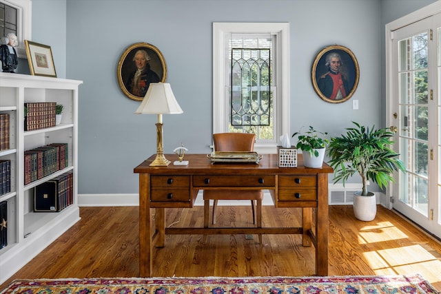 office area featuring wood finished floors and baseboards