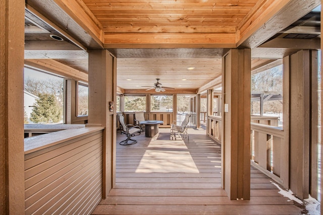 unfurnished sunroom featuring wood ceiling