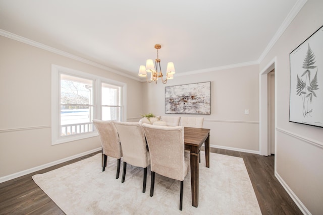 dining room featuring baseboards, visible vents, dark wood finished floors, and crown molding