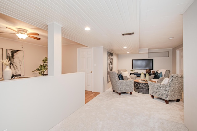 living area with recessed lighting, visible vents, ceiling fan, and light carpet