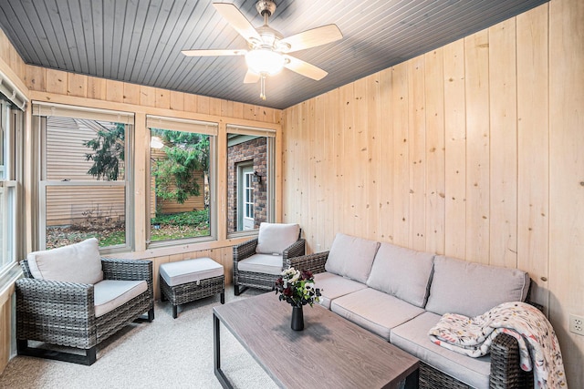 sunroom with wood ceiling and ceiling fan