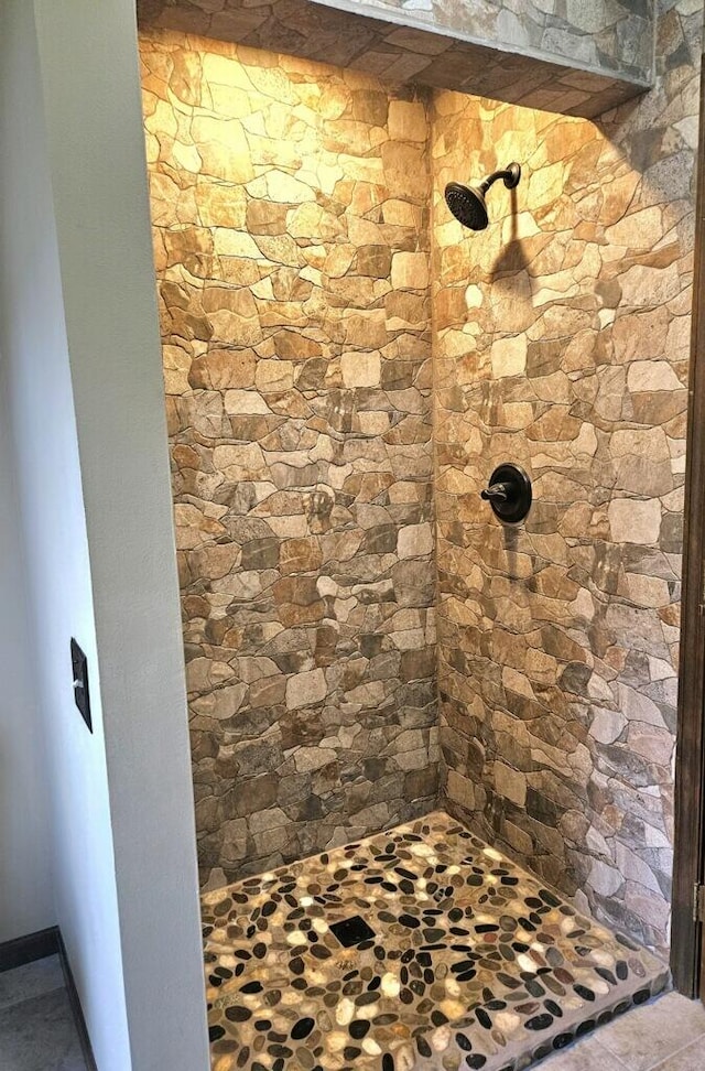 bathroom with a tile shower