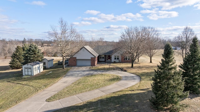 ranch-style home with a garage, brick siding, driveway, and a front lawn