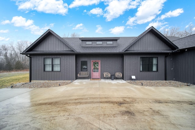 view of front of house with a shingled roof