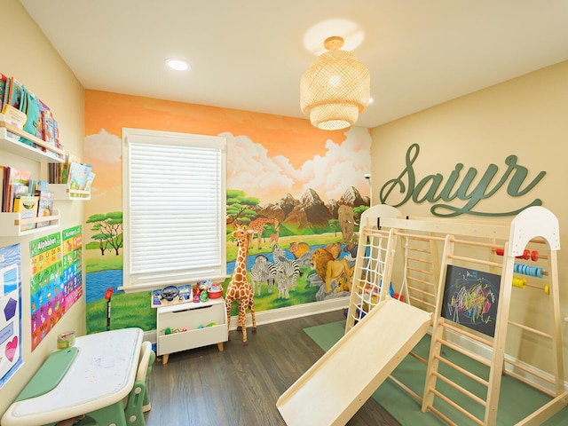 playroom with baseboards, dark wood-style flooring, and recessed lighting