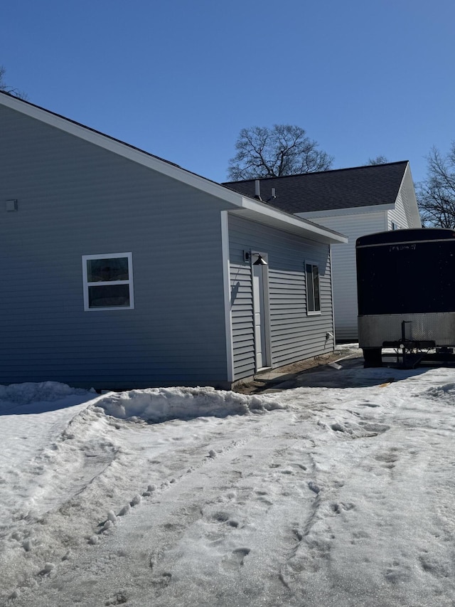 view of snow covered house