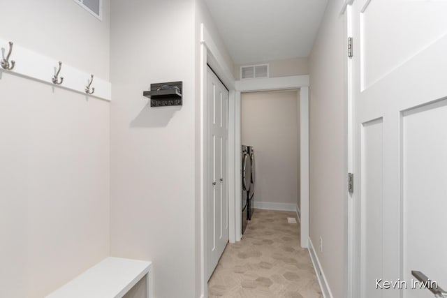 mudroom featuring baseboards and visible vents