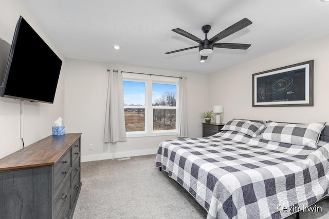 bedroom with light carpet, ceiling fan, baseboards, and recessed lighting