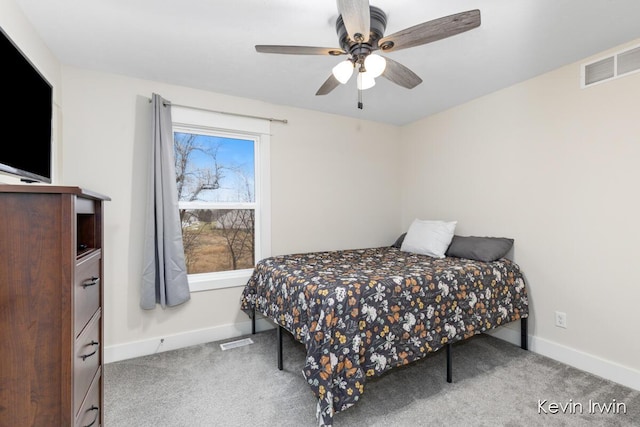 bedroom with carpet, visible vents, and baseboards