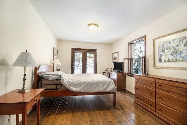 bedroom with dark wood-style floors, french doors, baseboards, and access to exterior