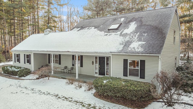 view of front of house with covered porch and roof with shingles