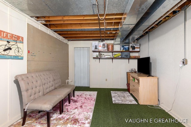 unfinished basement featuring dark carpet