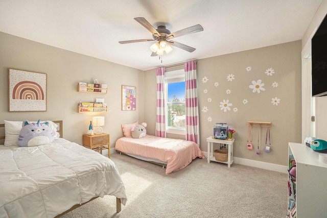 bedroom featuring a ceiling fan, carpet, and baseboards