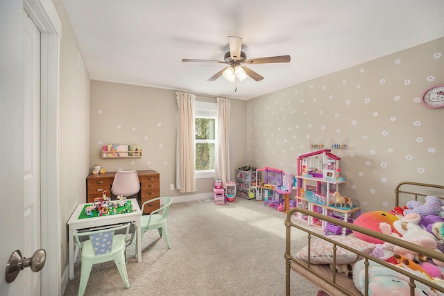 game room featuring ceiling fan, carpet, baseboards, and wallpapered walls