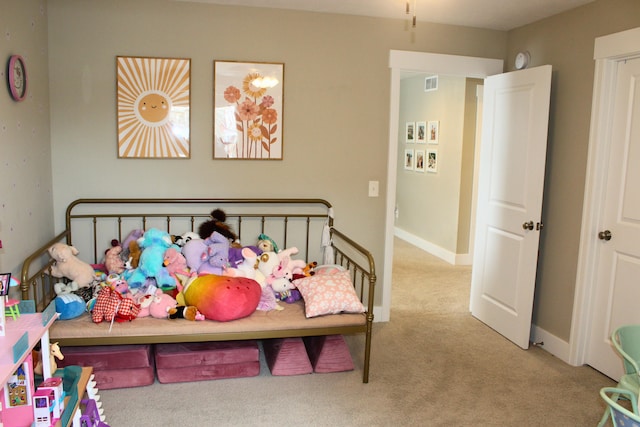 bedroom featuring light carpet, visible vents, and baseboards