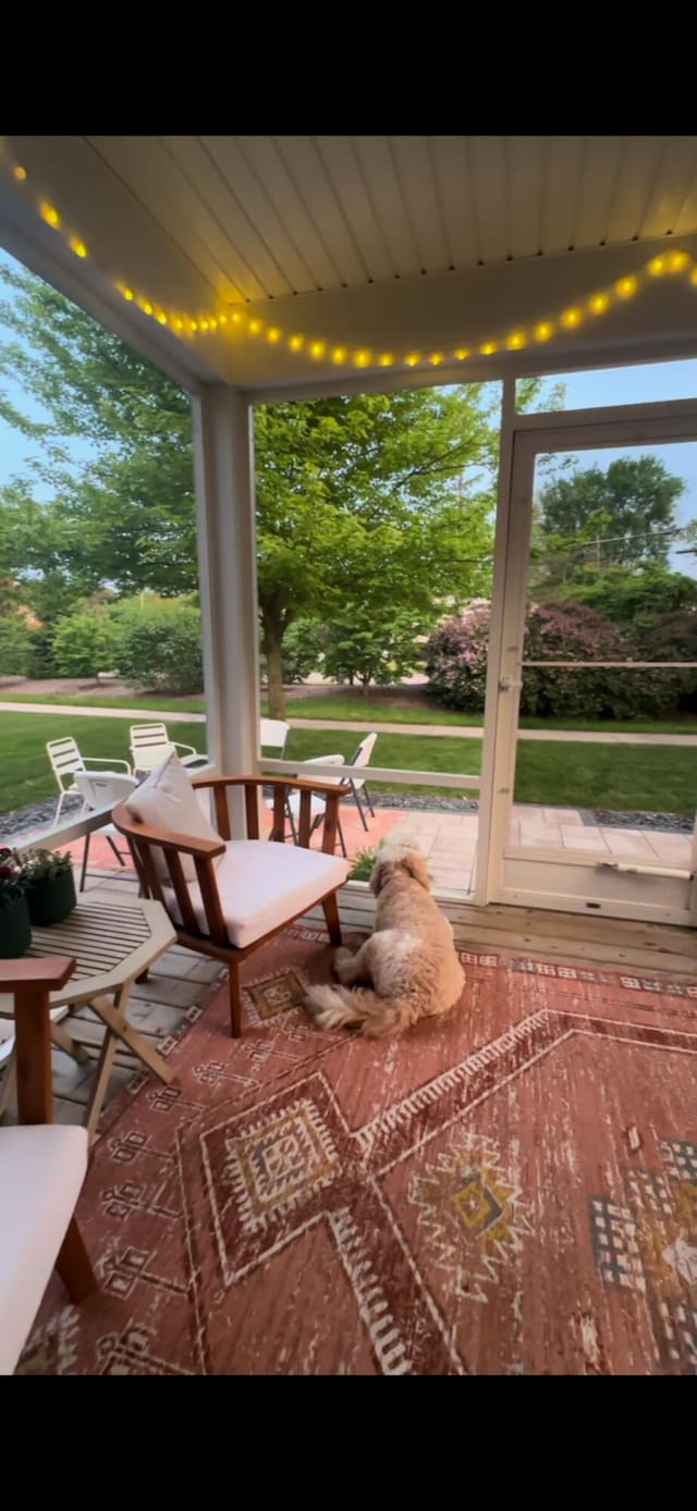 unfurnished sunroom with plenty of natural light