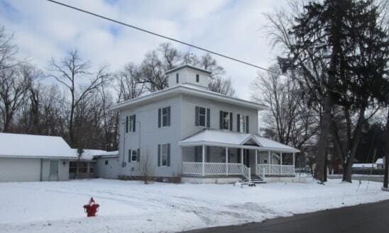 view of front of property with a garage and a porch