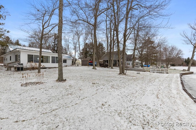 view of yard layered in snow