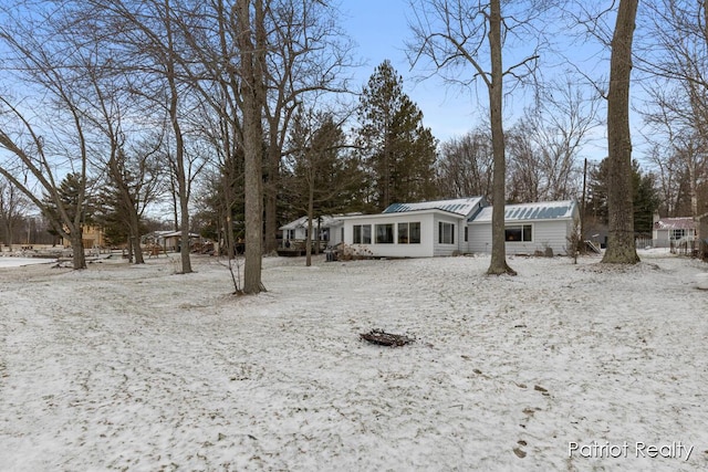 view of front of home featuring metal roof